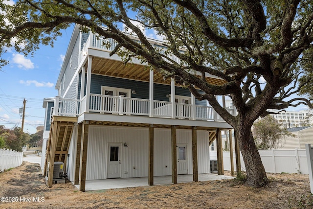back of house with a patio area and fence