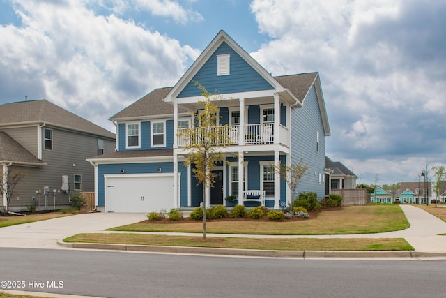 view of front of property with a porch, a balcony, an attached garage, driveway, and a shingled roof