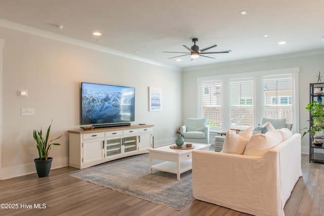 living room featuring a ceiling fan, wood finished floors, crown molding, recessed lighting, and baseboards
