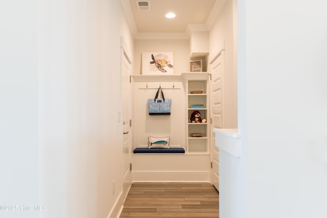 mudroom with wood finished floors, recessed lighting, ornamental molding, and baseboards