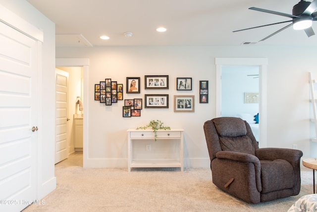 living area featuring carpet flooring, ceiling fan, recessed lighting, and baseboards
