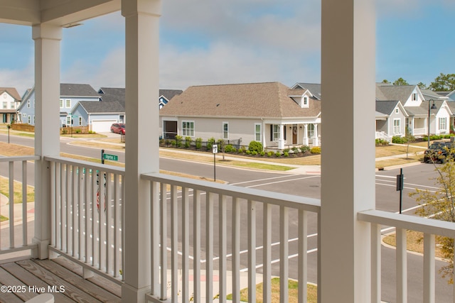balcony featuring a residential view and a porch