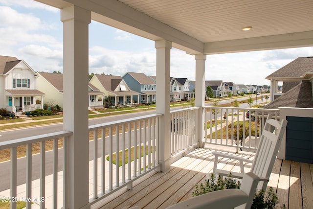 deck featuring a residential view and a porch