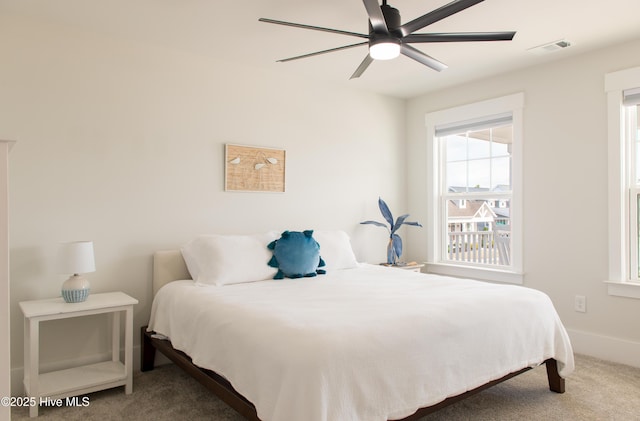 carpeted bedroom with a ceiling fan