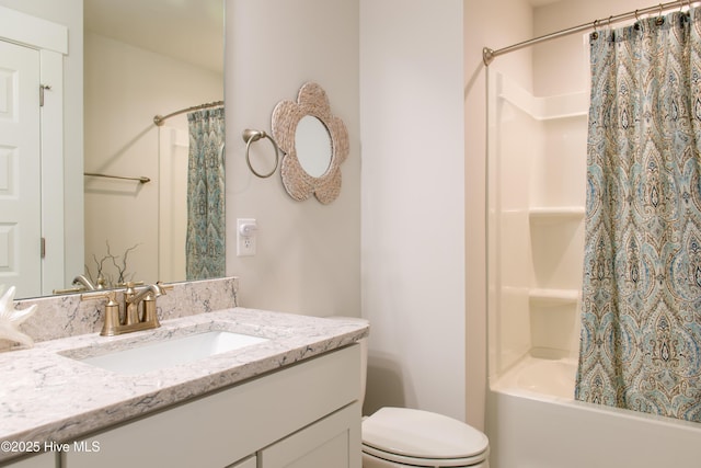 bathroom with toilet, shower / bath combination with curtain, and vanity