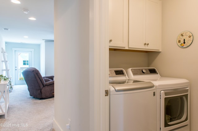 clothes washing area with washing machine and dryer, cabinet space, carpet floors, and recessed lighting