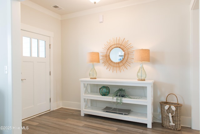 entrance foyer featuring wood finished floors and baseboards