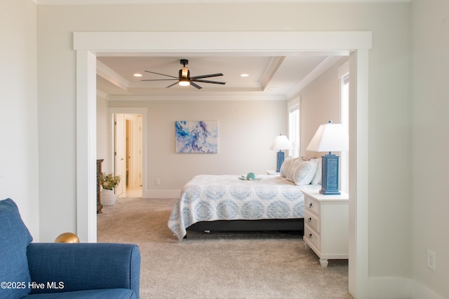 bedroom with a raised ceiling, crown molding, light carpet, recessed lighting, and baseboards
