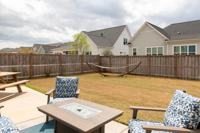 view of yard featuring a patio area and an outdoor fire pit