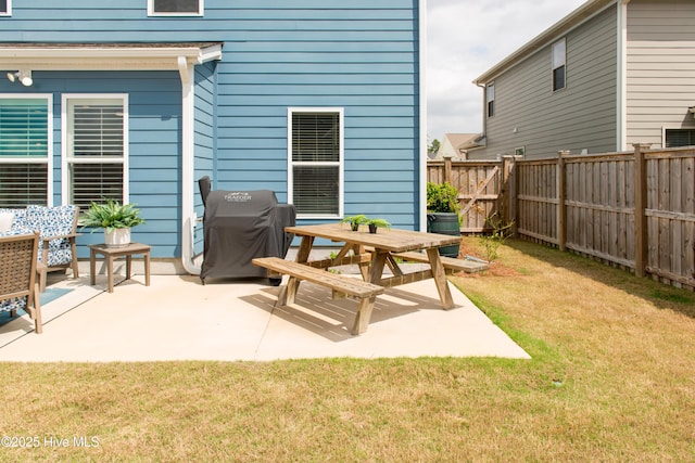 view of patio featuring a grill