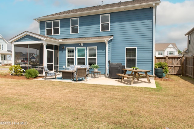 back of house with a patio, a sunroom, outdoor lounge area, and roof with shingles