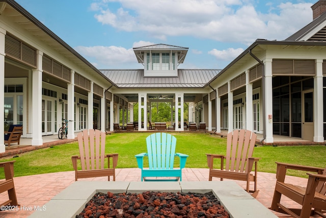 view of patio with an outdoor fire pit and french doors