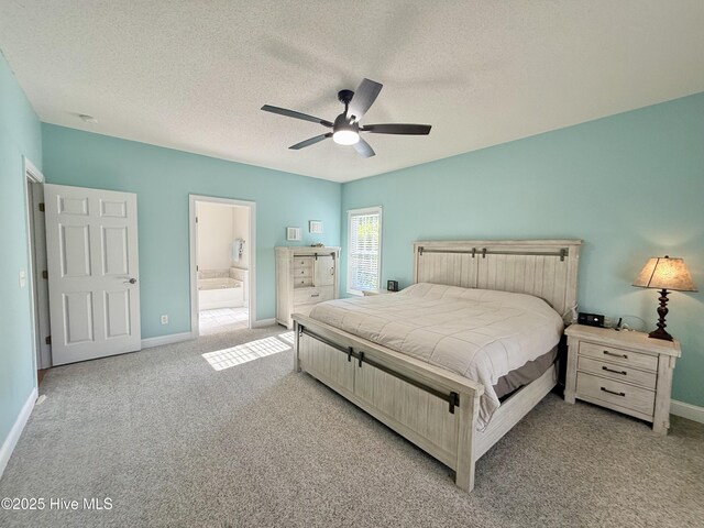 165 Laurel Oak Ln, Pinebluff, NC 28373 - carpeted bedroom featuring baseboards, a textured ceiling, ensuite bath, and a ceiling fan