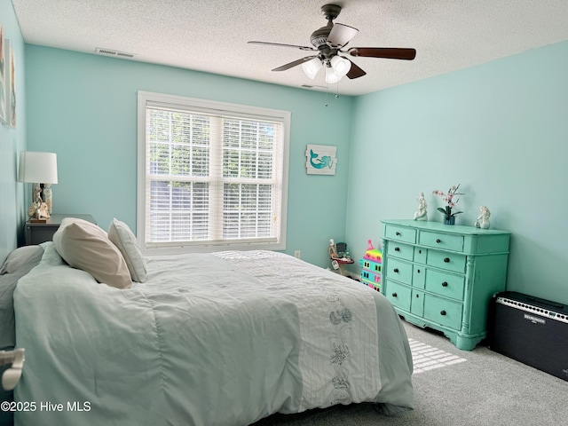 165 Laurel Oak Ln, Pinebluff, NC 28373 - bedroom with carpet flooring, a textured ceiling, and ceiling fan