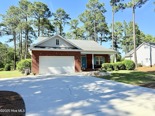 165 Laurel Oak Ln, Pinebluff, NC 28373 - view of front facade featuring brick siding, driveway, a garage, and a porch