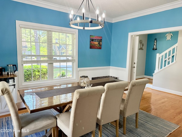 165 Laurel Oak Ln, Pinebluff, NC 28373 - dining space featuring a chandelier, crown molding, and wood finished floors