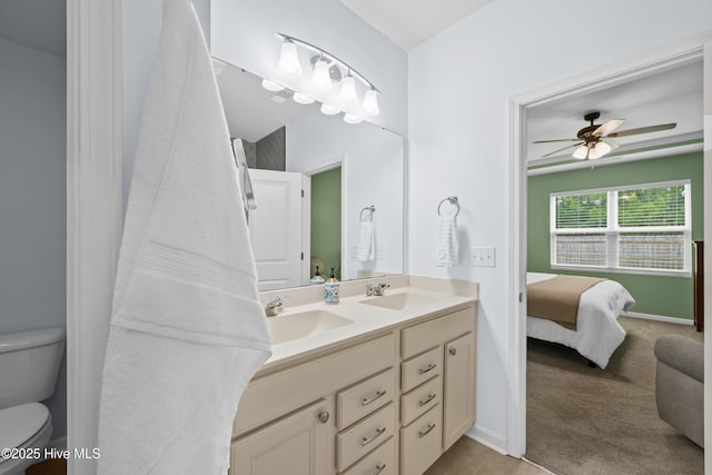 7351 Bellacroft Dr, Leland, NC 28451 - bathroom with double vanity, toilet, a ceiling fan, and ensuite bathroom