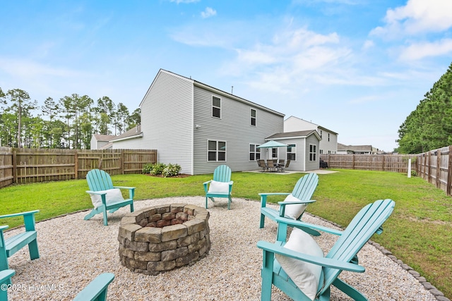 7351 Bellacroft Dr, Leland, NC 28451 - view of patio featuring a fire pit
