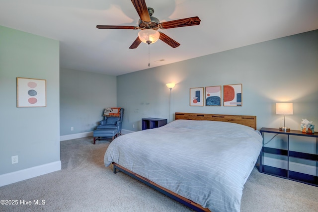 carpeted bedroom with baseboards and ceiling fan