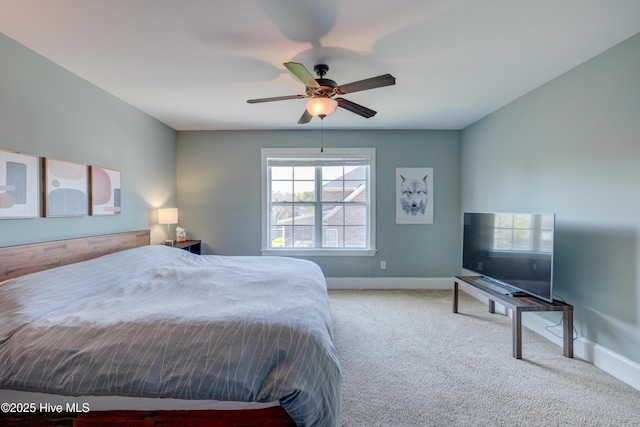 bedroom with carpet, baseboards, and ceiling fan
