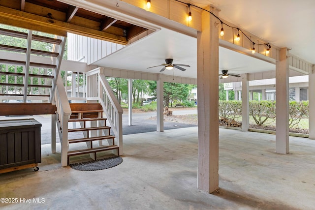 view of patio / terrace with a ceiling fan and stairway