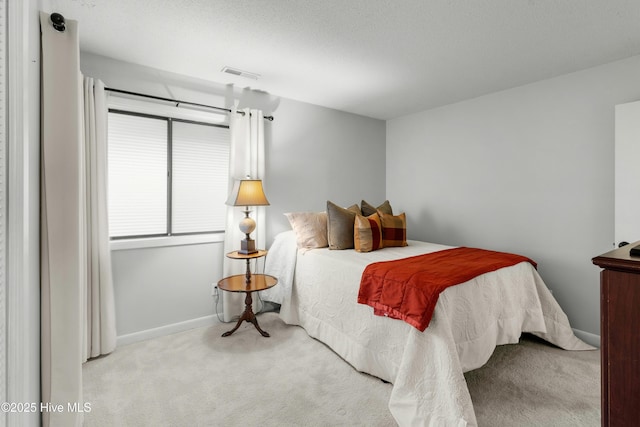 bedroom with carpet and baseboards