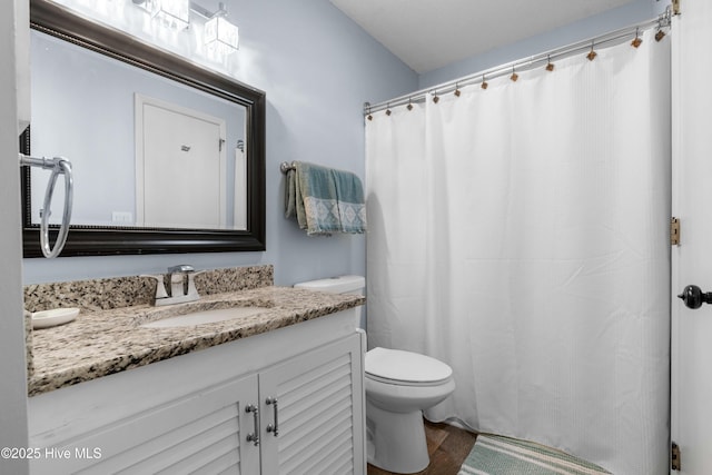 full bathroom with toilet, wood finished floors, vanity, and a shower with shower curtain