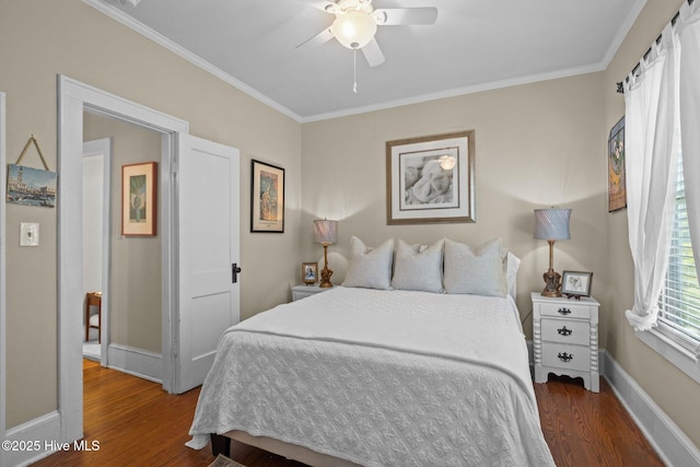 bedroom with baseboards, ornamental molding, and wood finished floors