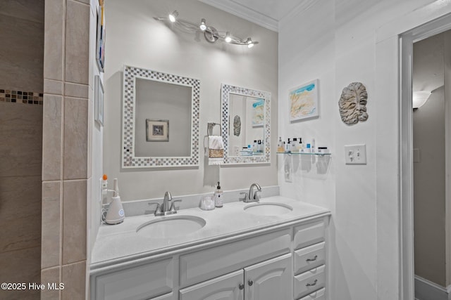 full bathroom with double vanity, a sink, and ornamental molding