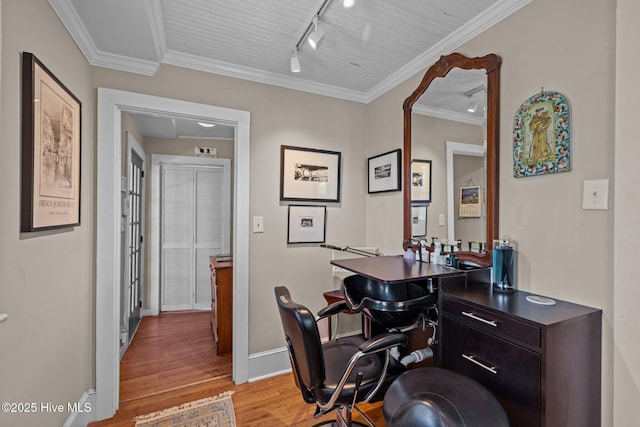 office with rail lighting, ornamental molding, baseboards, and light wood finished floors