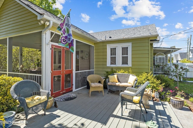 wooden terrace featuring an outdoor hangout area
