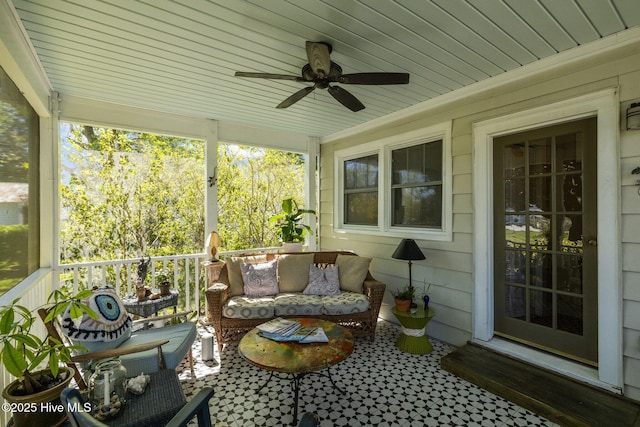 sunroom / solarium with an outdoor hangout area and ceiling fan