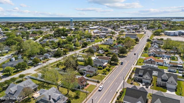 birds eye view of property with a residential view and a water view