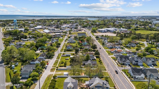 birds eye view of property with a residential view and a water view