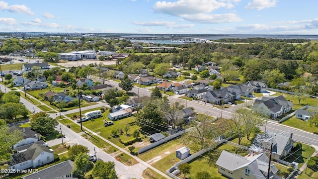 drone / aerial view with a water view and a residential view