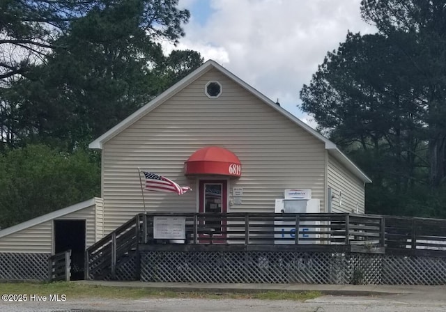 view of front of home featuring a wooden deck