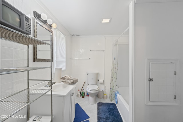 full bathroom featuring tile patterned flooring, vanity, toilet, and shower / washtub combination