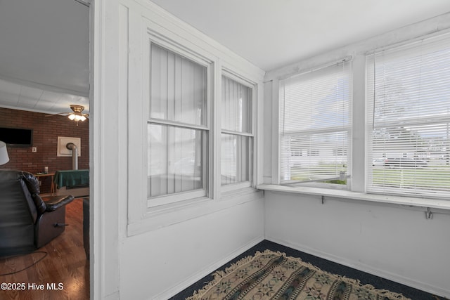 sunroom / solarium with a wood stove