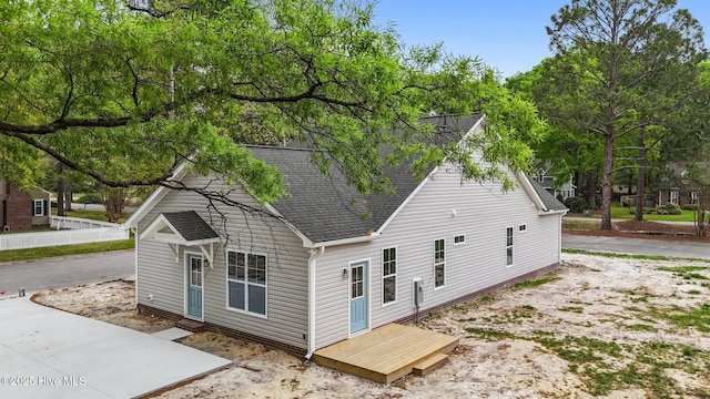 exterior space with a shingled roof
