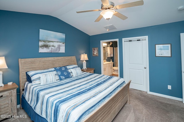 carpeted bedroom with visible vents, baseboards, a ceiling fan, ensuite bath, and lofted ceiling