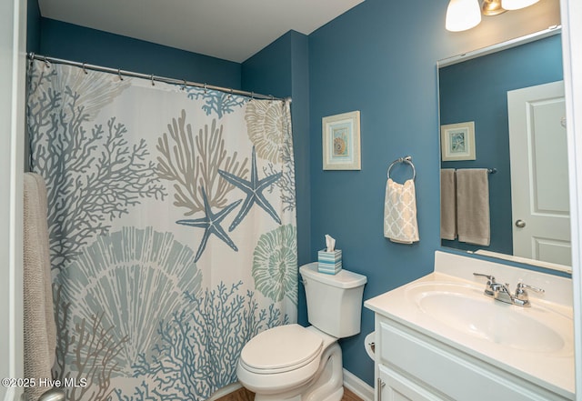 bathroom with toilet and vanity