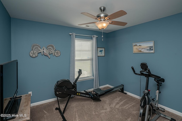 workout area with visible vents, baseboards, and ceiling fan