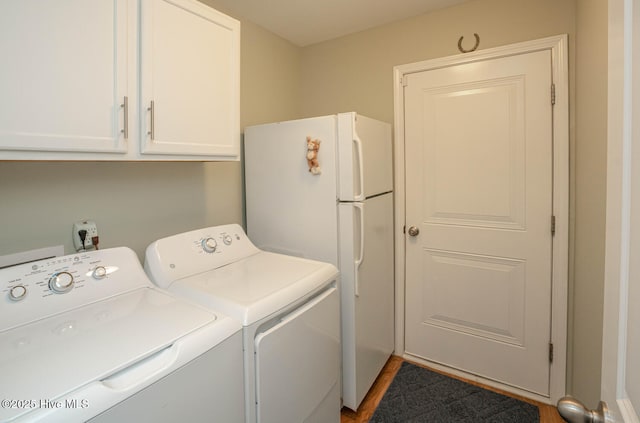 laundry area with washer and dryer and cabinet space
