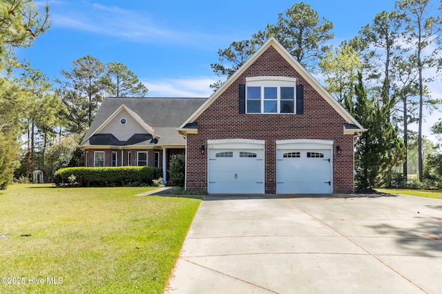 3400 Canmorre Ct, Fayetteville, NC 28306 - view of front facade with a front yard, driveway, brick siding, and a garage