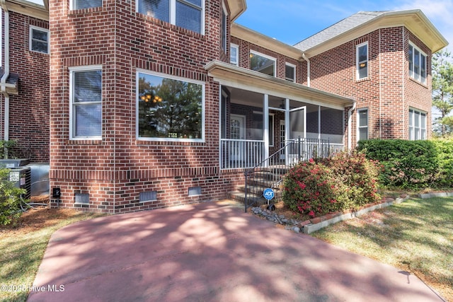 3400 Canmorre Ct, Fayetteville, NC 28306 - back of property featuring crawl space, cooling unit, and brick siding