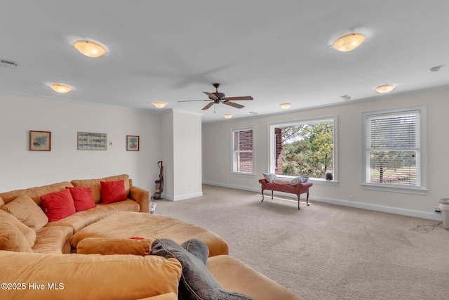 3400 Canmorre Ct, Fayetteville, NC 28306 - living room with ornamental molding, baseboards, a ceiling fan, and light carpet