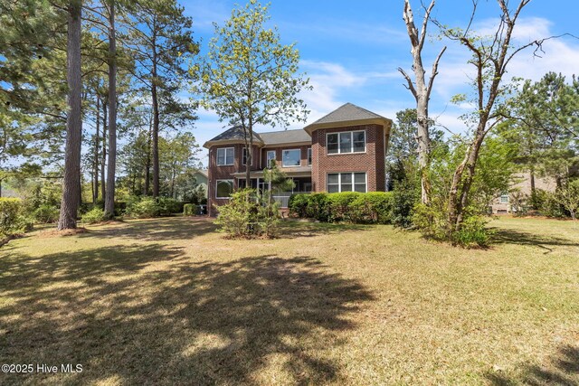 3400 Canmorre Ct, Fayetteville, NC 28306 - rear view of property featuring a yard and brick siding