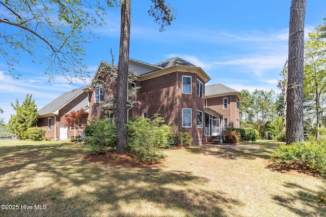 3400 Canmorre Ct, Fayetteville, NC 28306 - view of home's exterior featuring a yard and brick siding