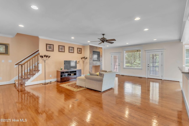3400 Canmorre Ct, Fayetteville, NC 28306 - living room with crown molding, ceiling fan, and wood finished floors