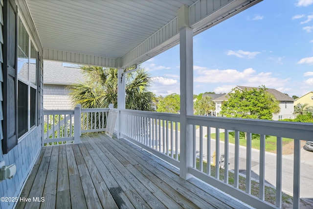 wooden terrace with a residential view